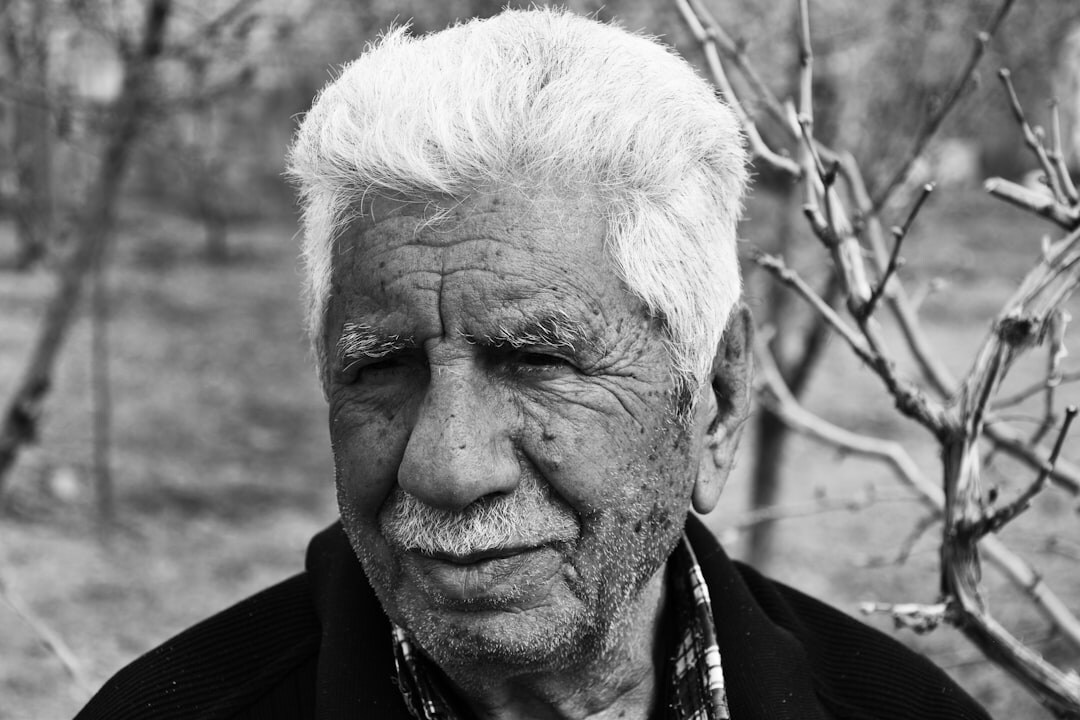 Portrait of a distinguished older man with grey hair