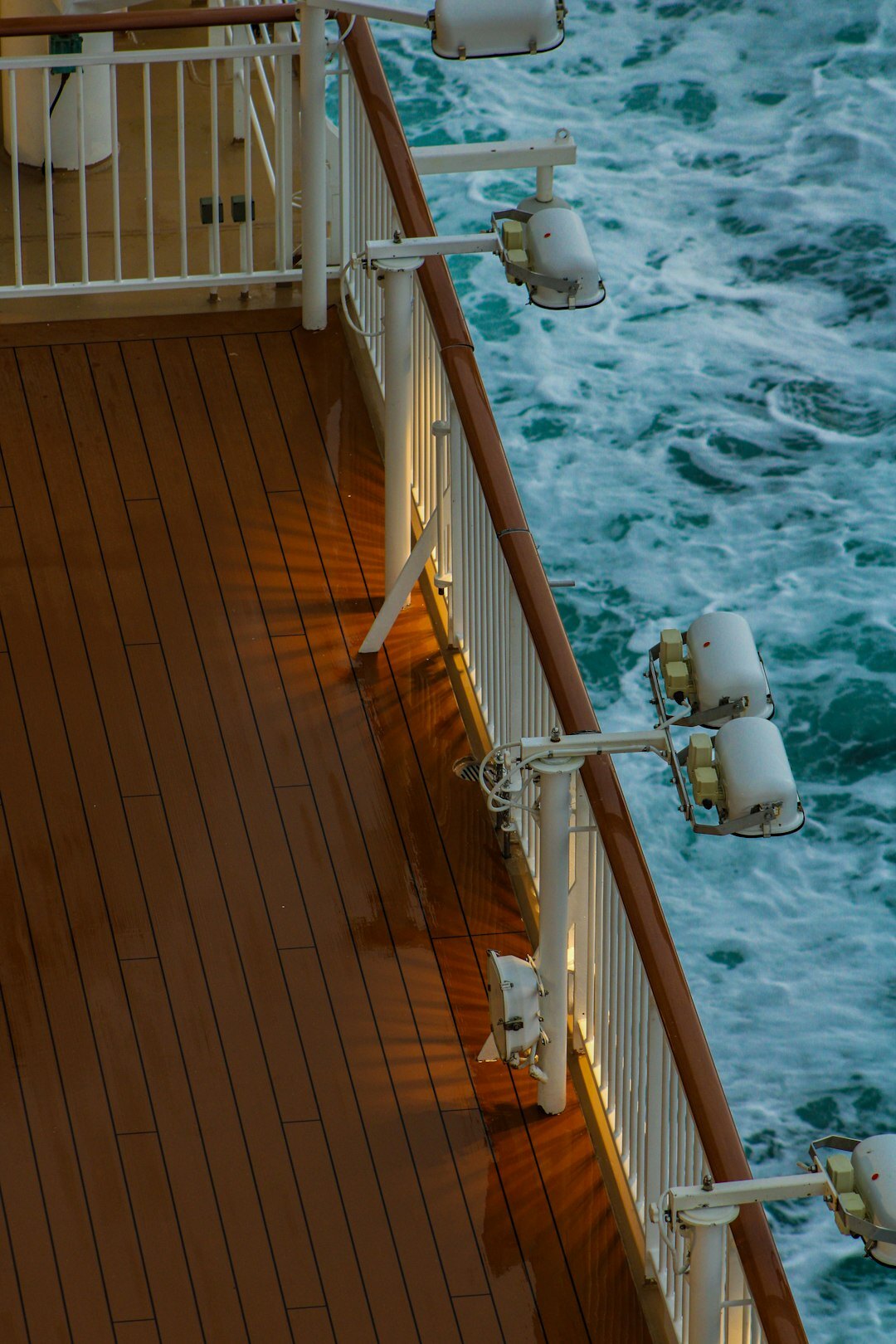 Steel diving chronograph watch on a boat deck